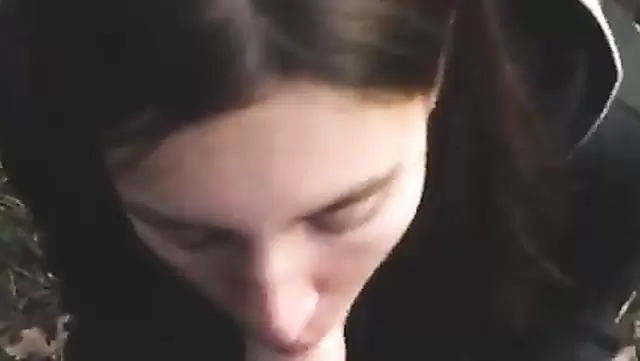 Russian teen gives a blowjob to a guy in the woods